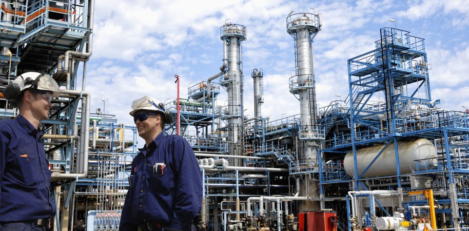 bigstock-refinery-workers-inside-large-107705423-e1470024962541